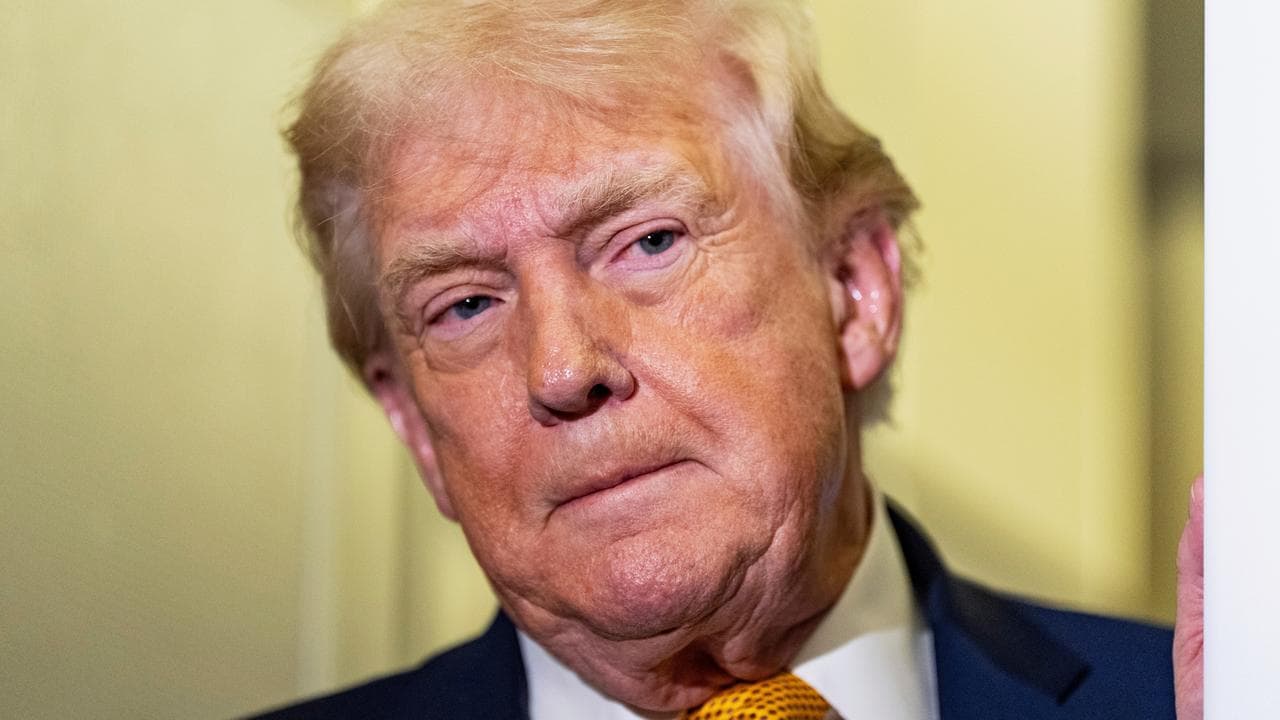 President Donald Trump speaks to reporters on Air Force One