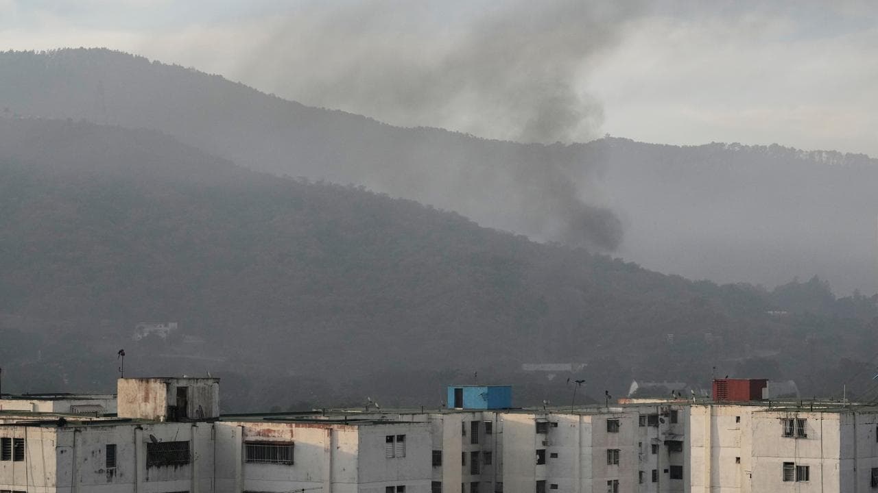 Smoke rises from Fort Tiuna, the main military garrison in Caracas
