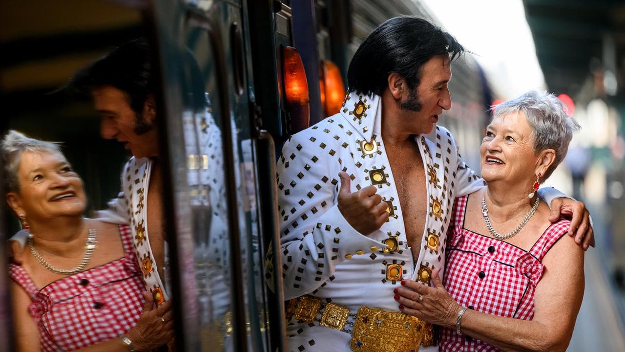 An Elvis impersonator and a fan