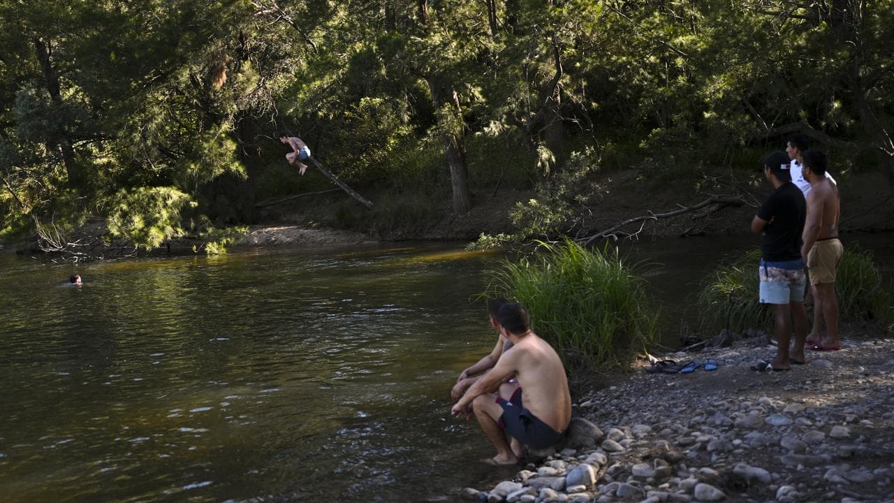 A man jumps into the water at Cotter Bend near Canberra (file image)