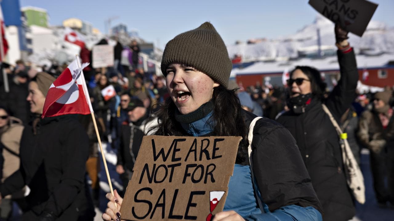 People protest in front of the US consulate in Nuuk, Greenland