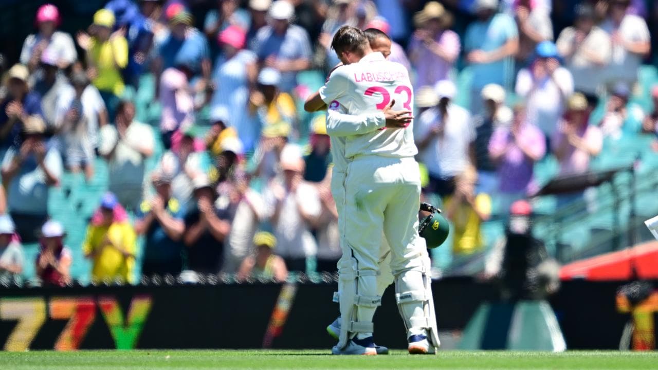Usman Khawaja receives a warm hug from Marnus Labuschagne