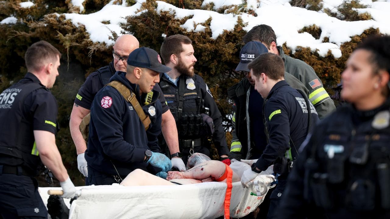 Paramedics aid a person who was shot by an ICE officer in Minneapolis