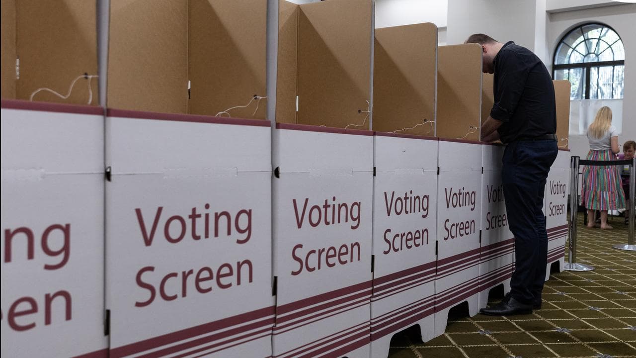A person voting in Brisbane.