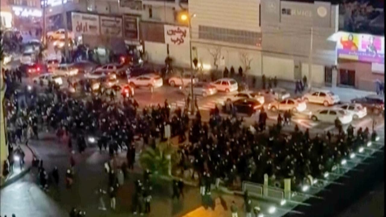 Video grab of protesters blocking an intersection in Tehran, Iran