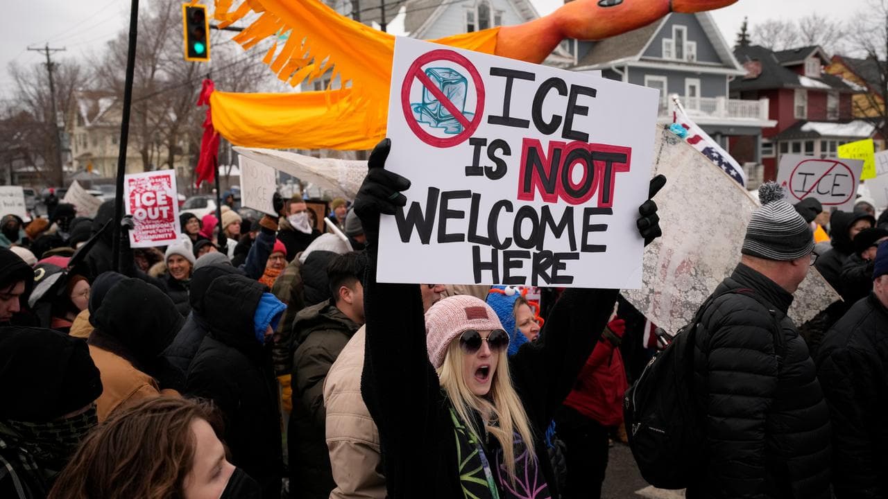 Protesters march during a rally for Renee Good