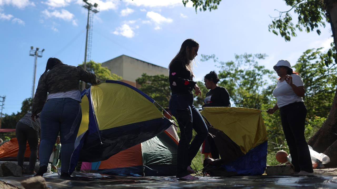 People set up tents near a prison in Zamora