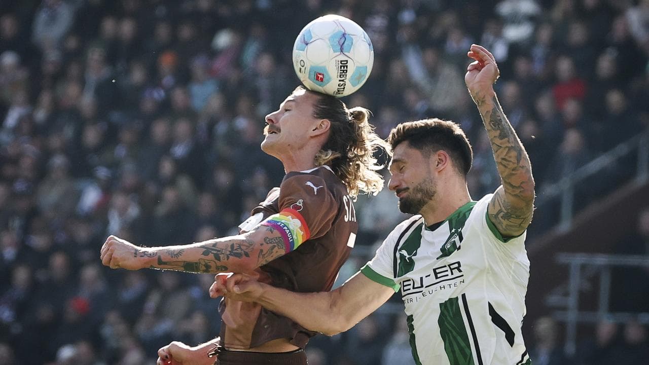 St Pauli's Jackson Irvine, left.