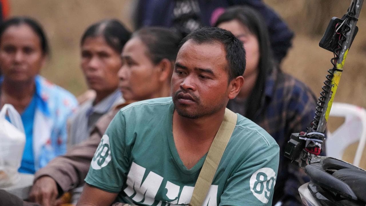Relatives of victims after a crane fell onto a train in Thailand
