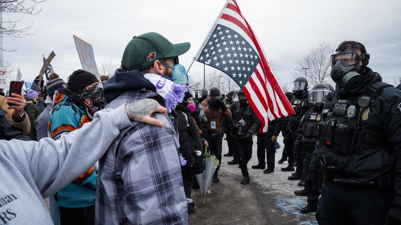 Minneapolis Police Department officers face off with protesters
