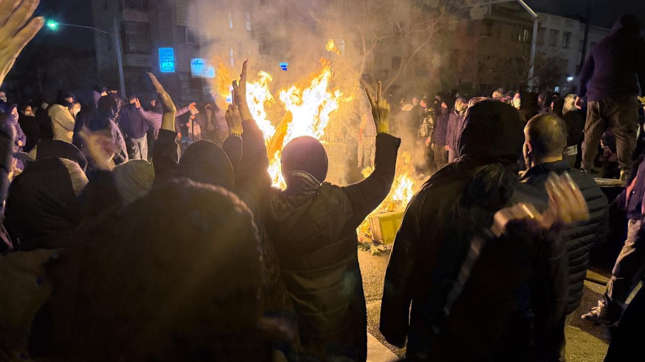 Iranians attend an anti-government protest in Tehran, Iran