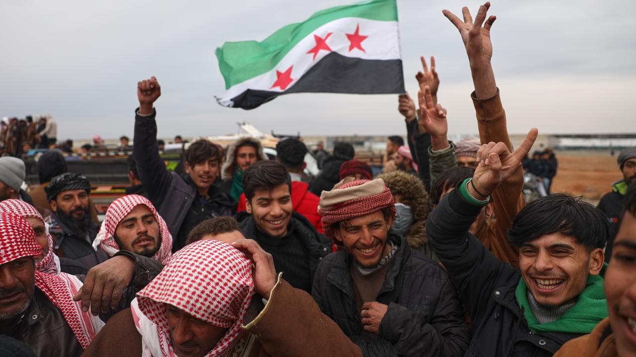 People celebrate in the town of Maskana