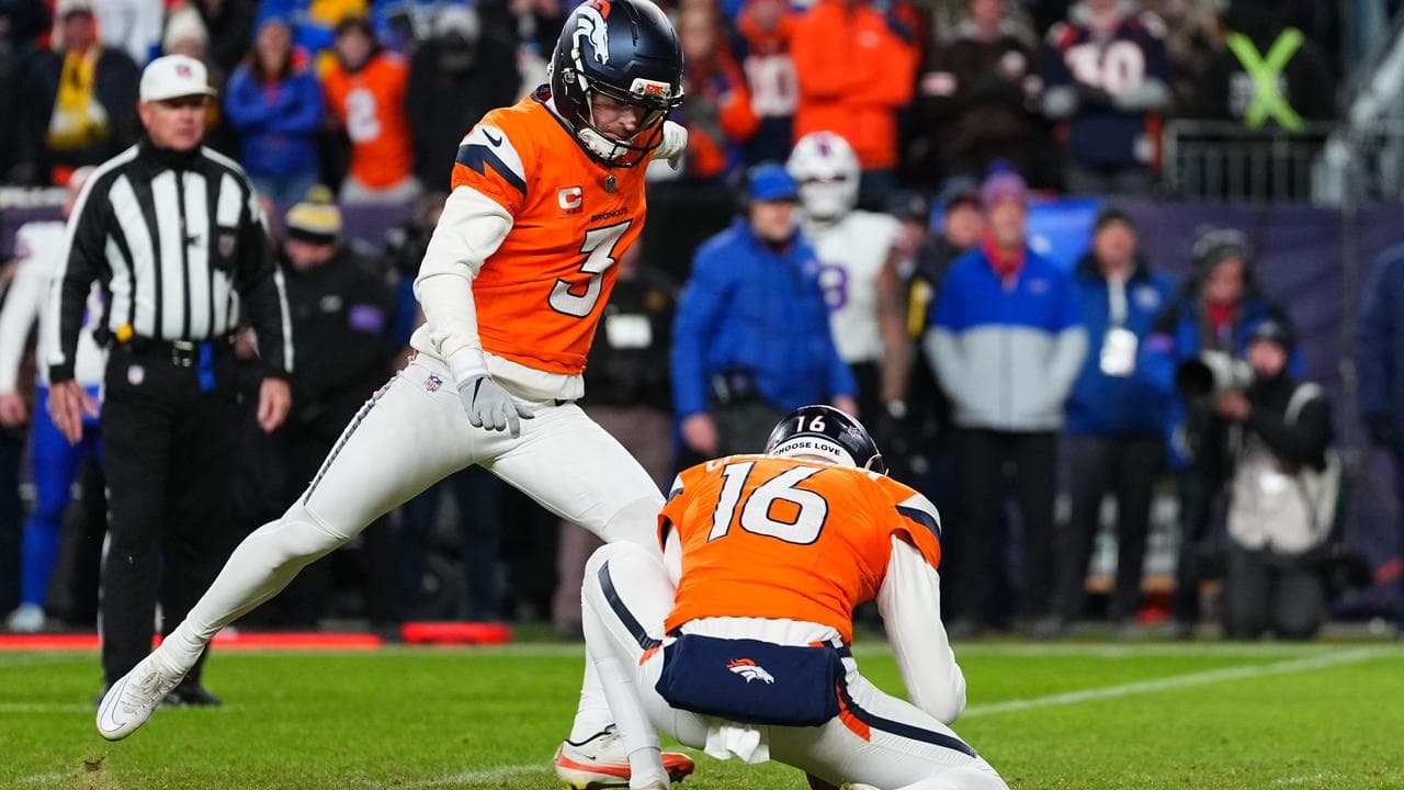 Wil Lutz kicks a field goal assisted by Australian Jeremy Crawshaw.