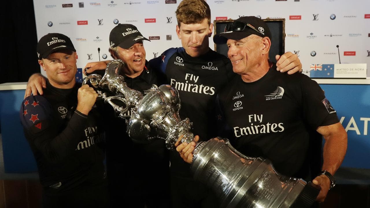 Skipper Ashby and New Zealand teammates with the America's Cup.
