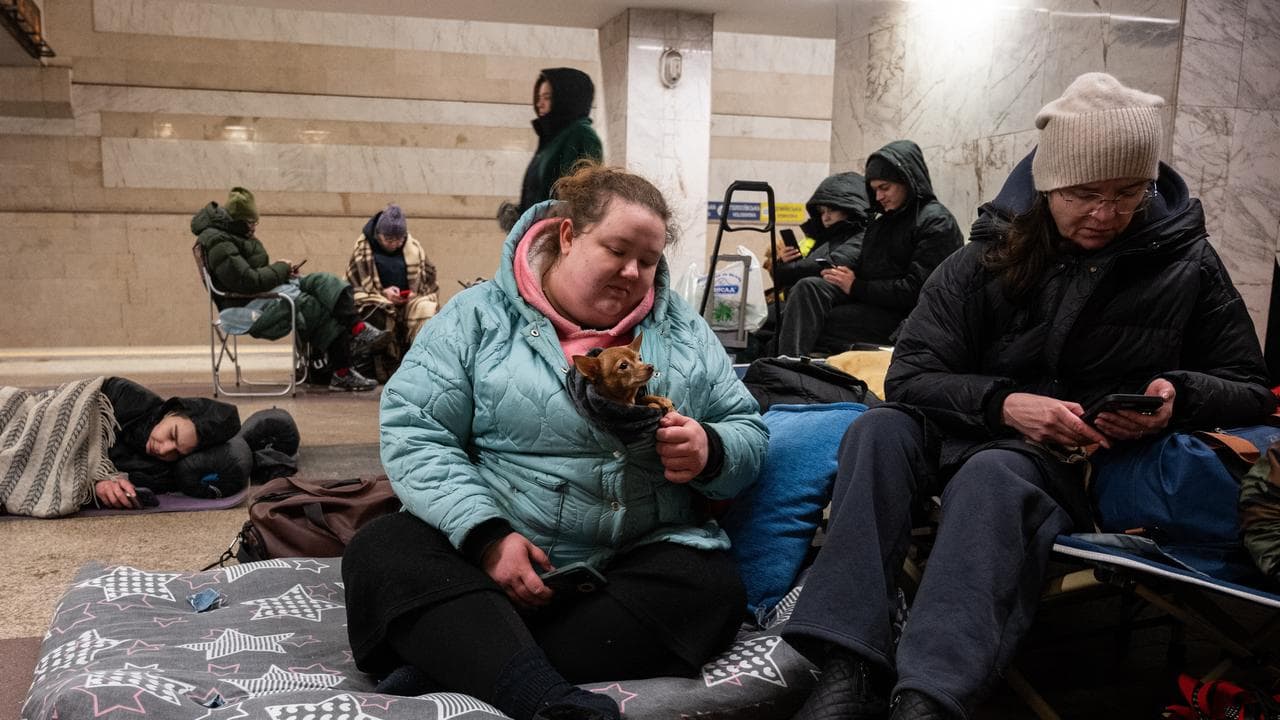 People take shelter in a subway station