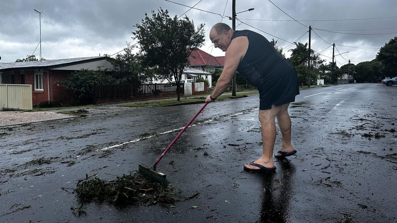 A person weeps debris after a storm (file image)