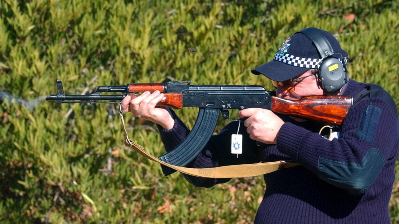 Someone firing an AK47 rifle.