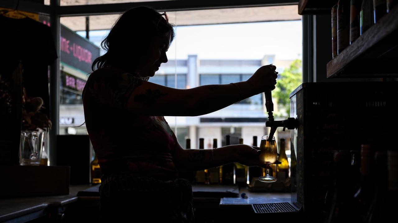 Pub working pulling a beer