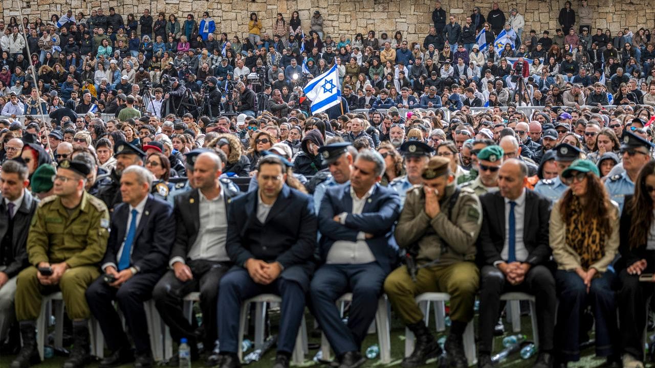 Mourners attend the funeral