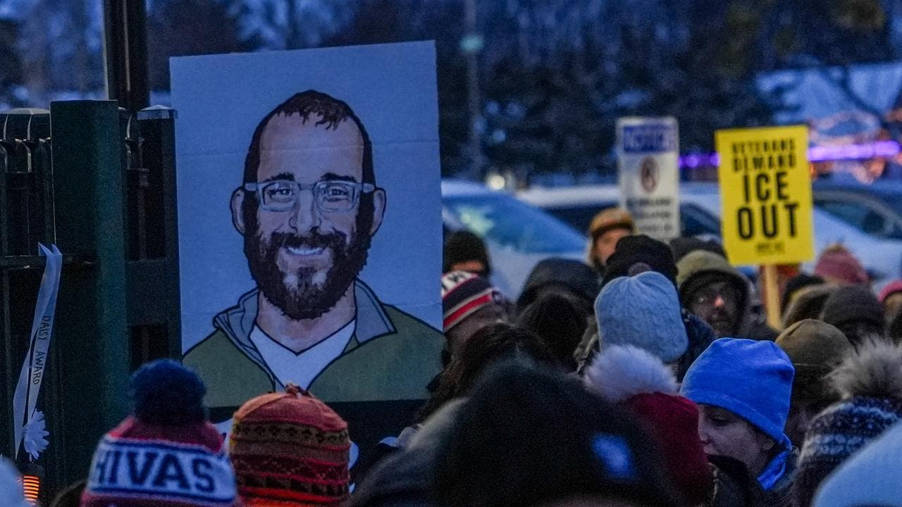 People attend a vigil for Alex Pretti