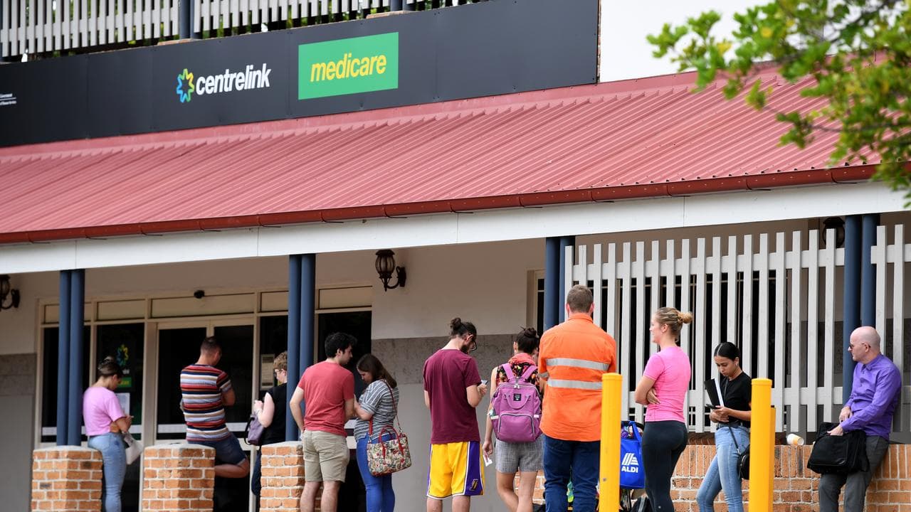 People queue outside a Centrelink office (file image)