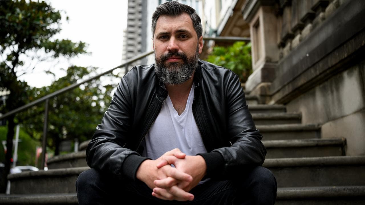 Tom Raue poses for a photograph outside the Downing Centre Courts