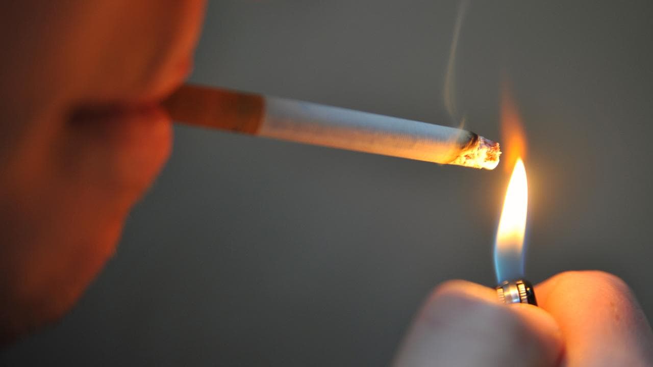 A person lighting a cigarette (file image)