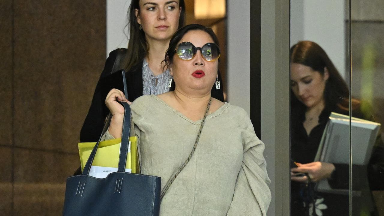 Co-accused Cheng Christine Zhang (centre)