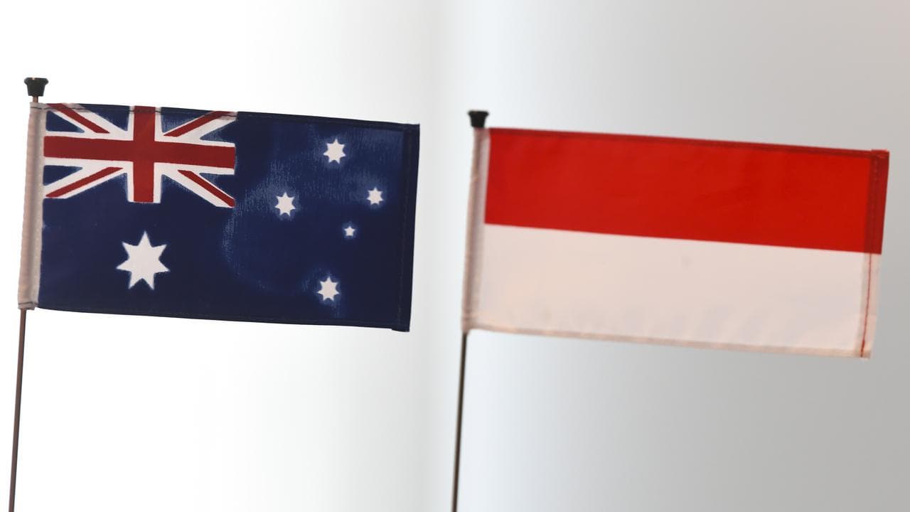 Australian and an Indonesian flags