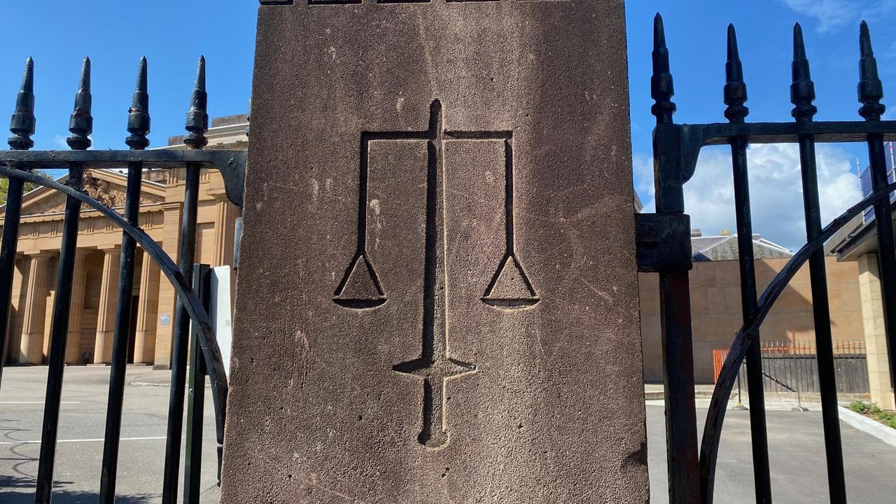 The scales of justice engraved on a pillar