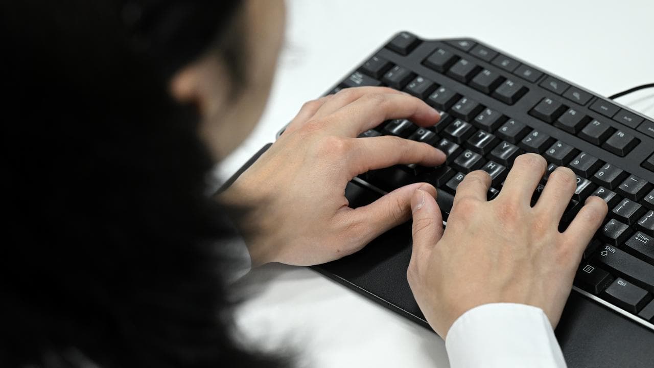 A person typing on a keyboard (file image)