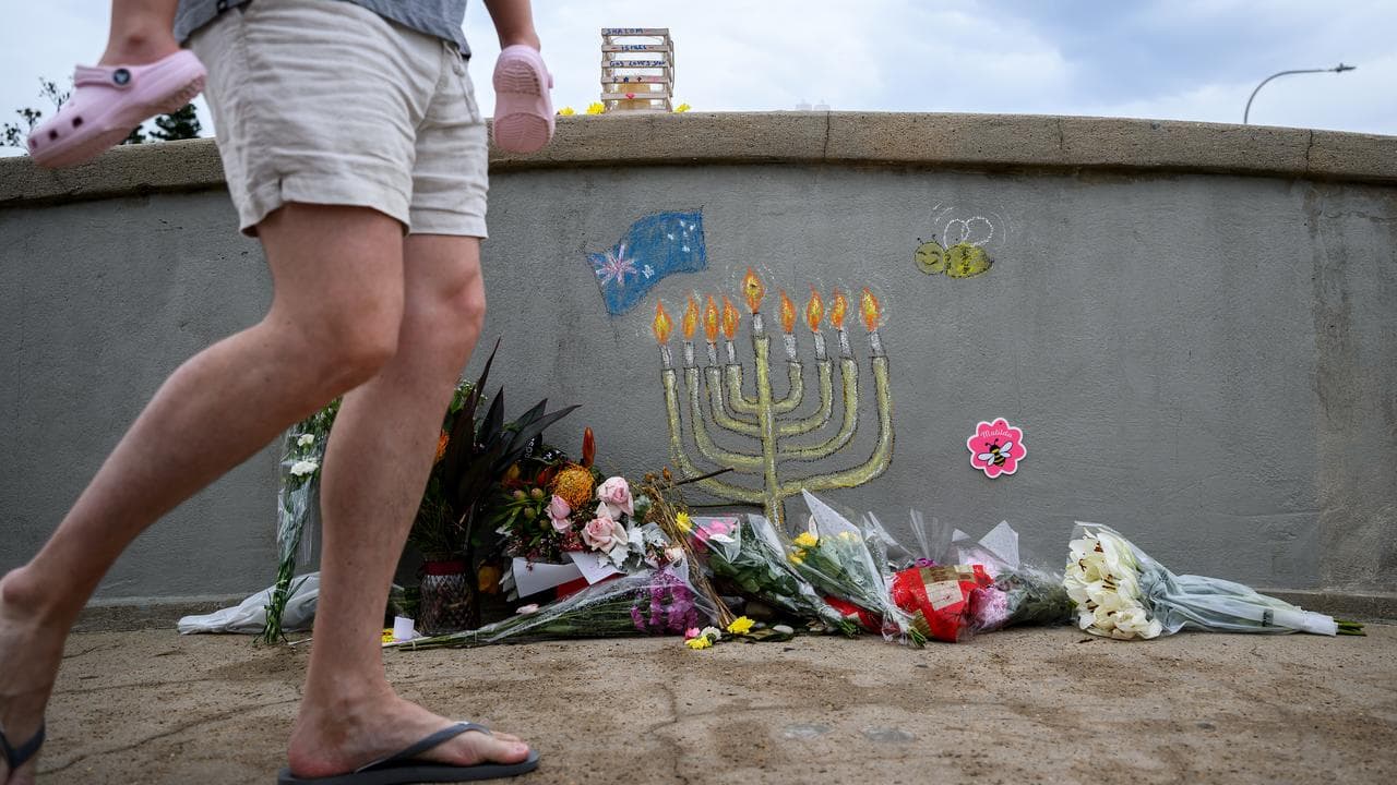 A memorial on the footbridge used to carry out the Bondi terror attack