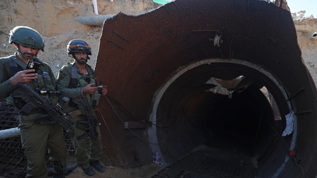 Israeli Army shows soldiers at the entrance of a tunnel