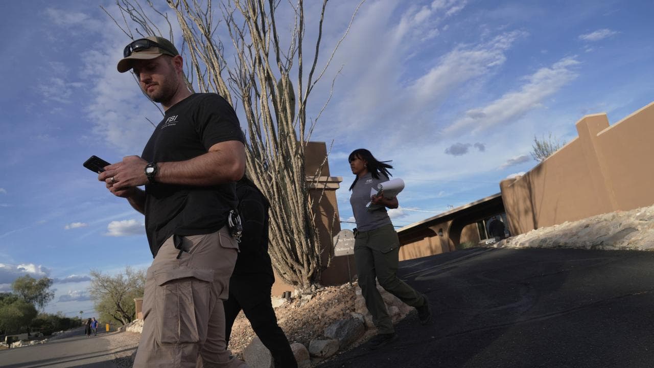 Law enforcement agents search for Nancy Guthrie outside Tuscon