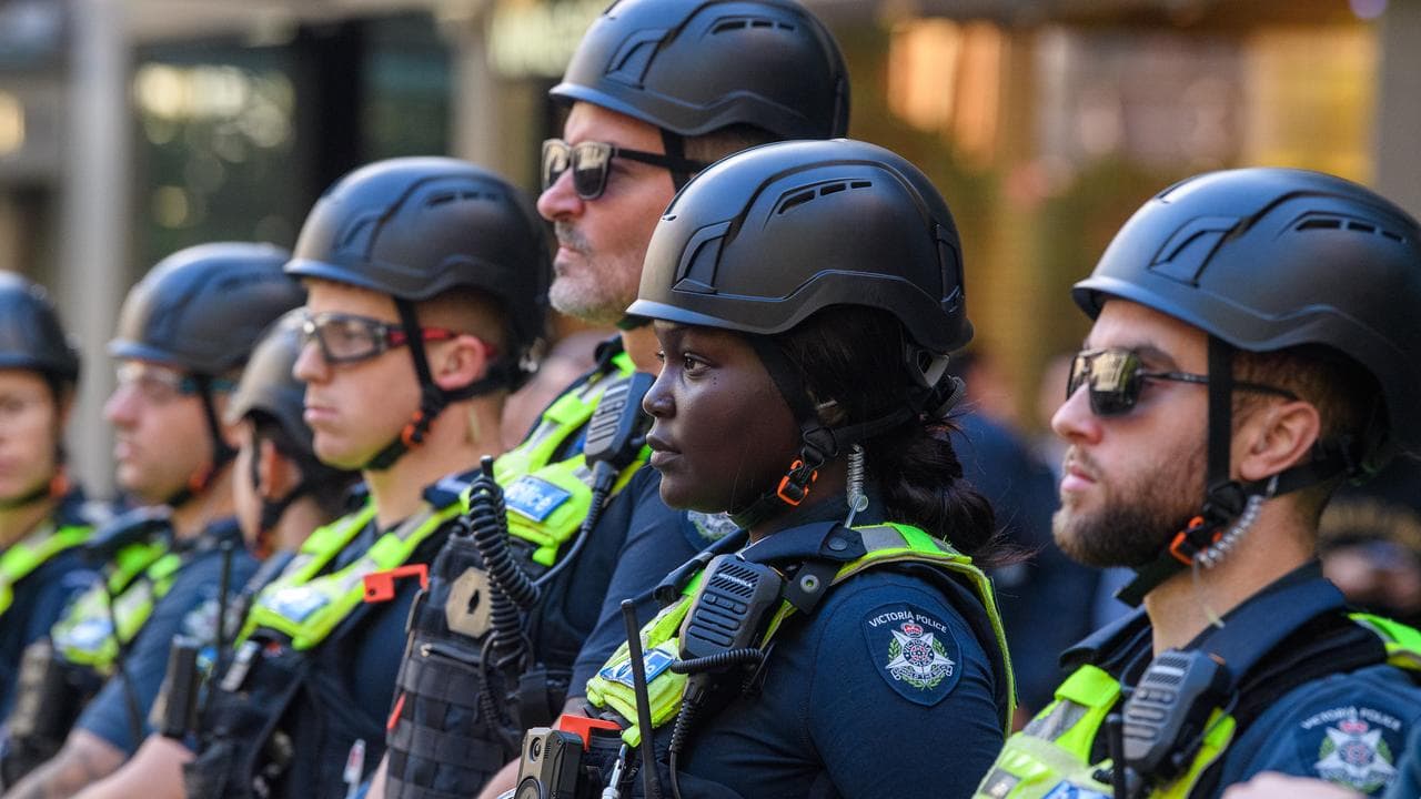 Police at a rally outside Flinders Street Station in Melbourne