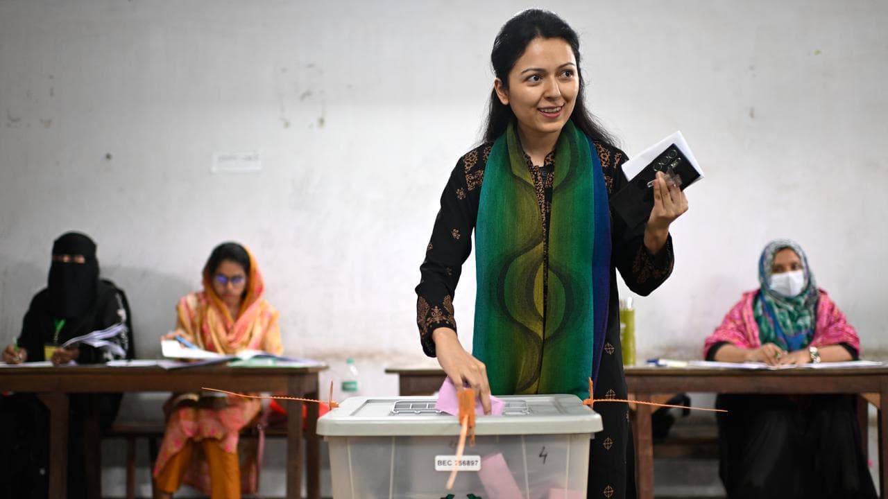 A woman casts her vote