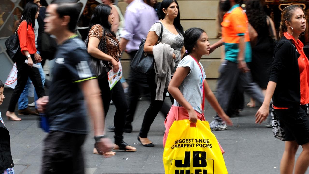 A shopper with a JB Hi Fi bag