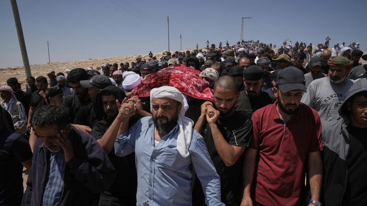 Mourners at the West Bank funeral