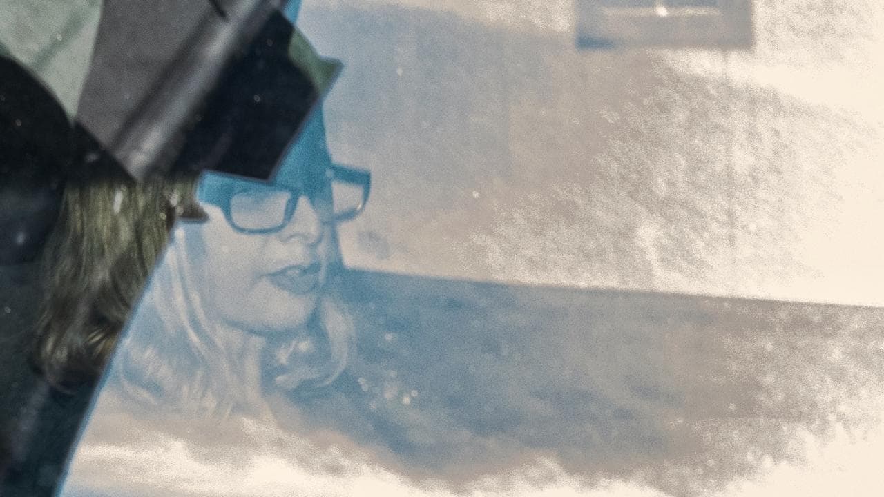 Lisa Lines seen through car window
