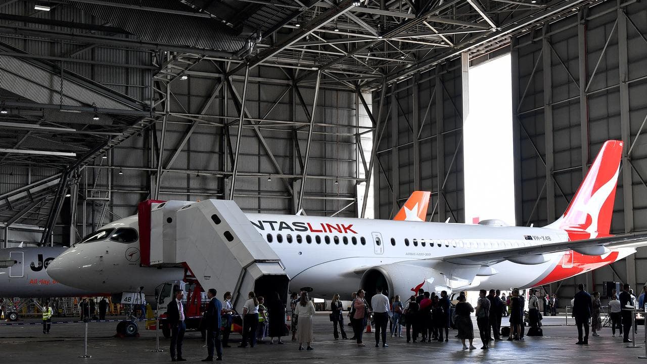 A QantasLink aircraft in a hangar