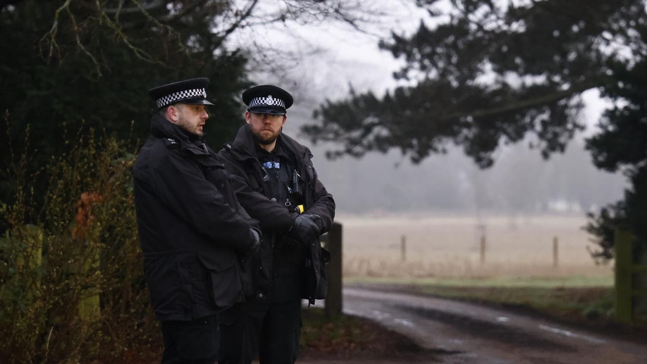 Police outside the farm where Mountbatten-Windsor was arrested.