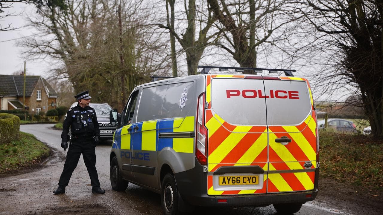 A police van patrols the area around Wood Farm, Sandringham
