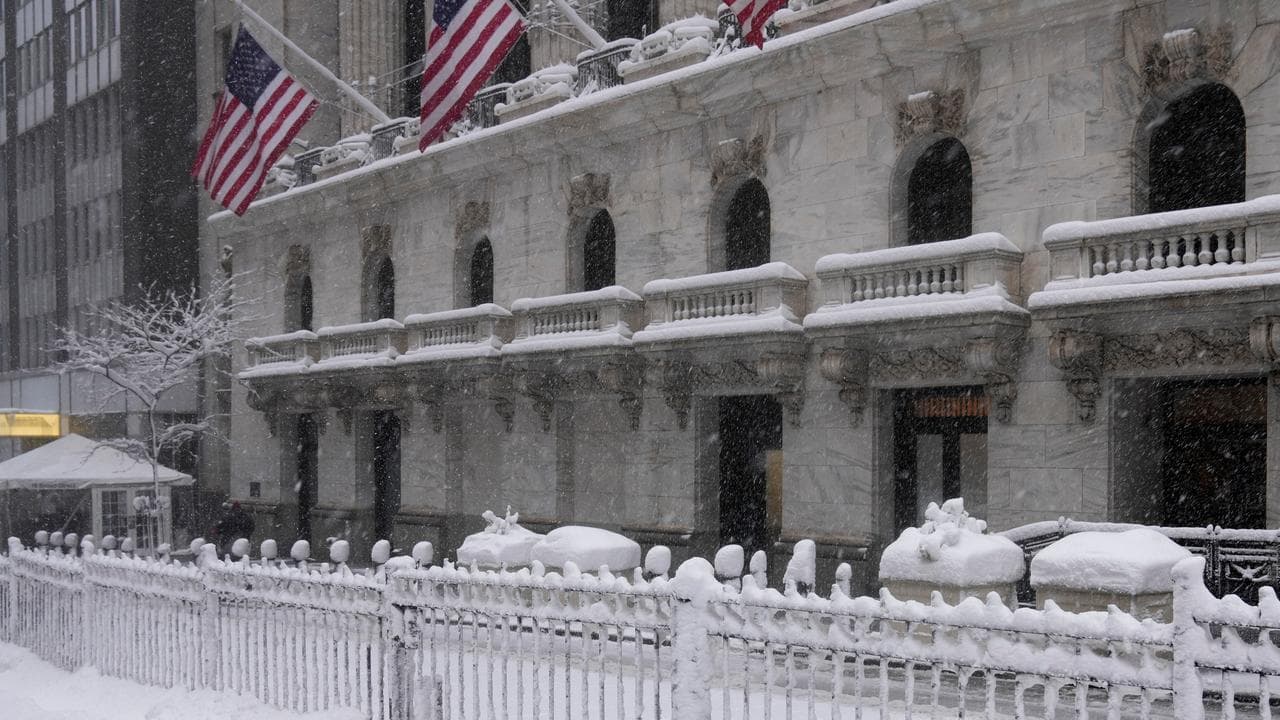 Boy plays in snow outside NYSE