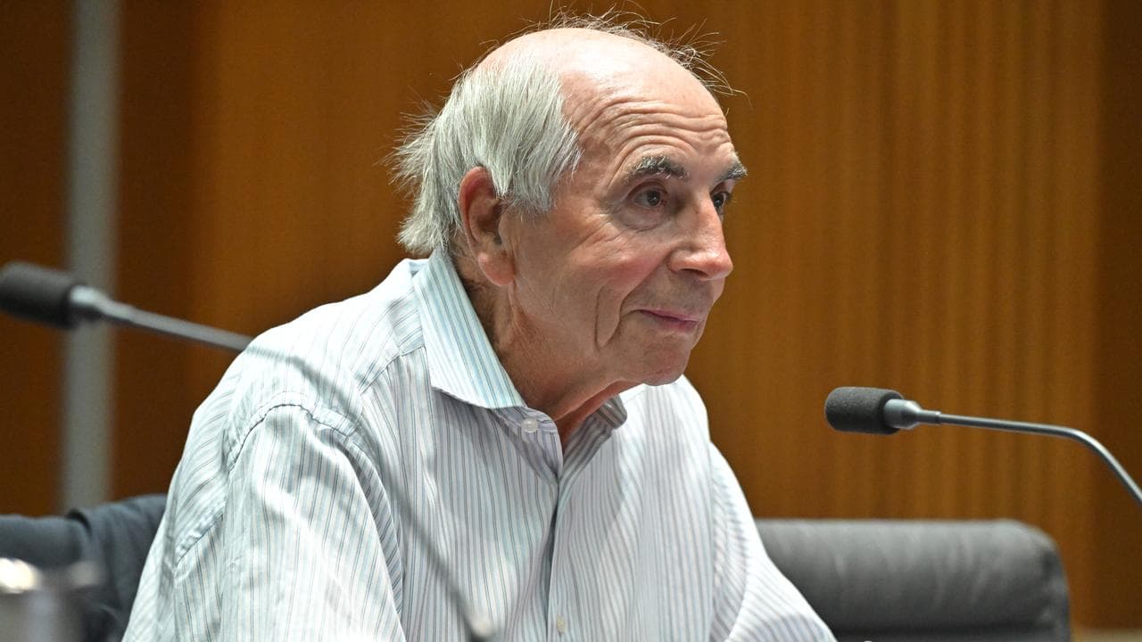 Bernie Fraser appears at a public hearing