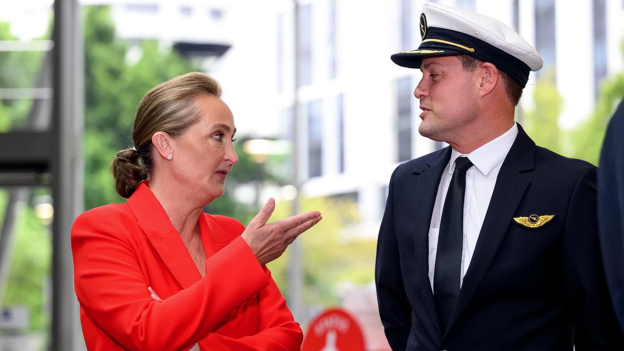 Qantas boss Vanessa Hudson chats to a colleague