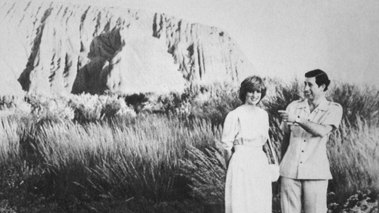 Britain's Prince Charles jokes with his wife Princess Diana