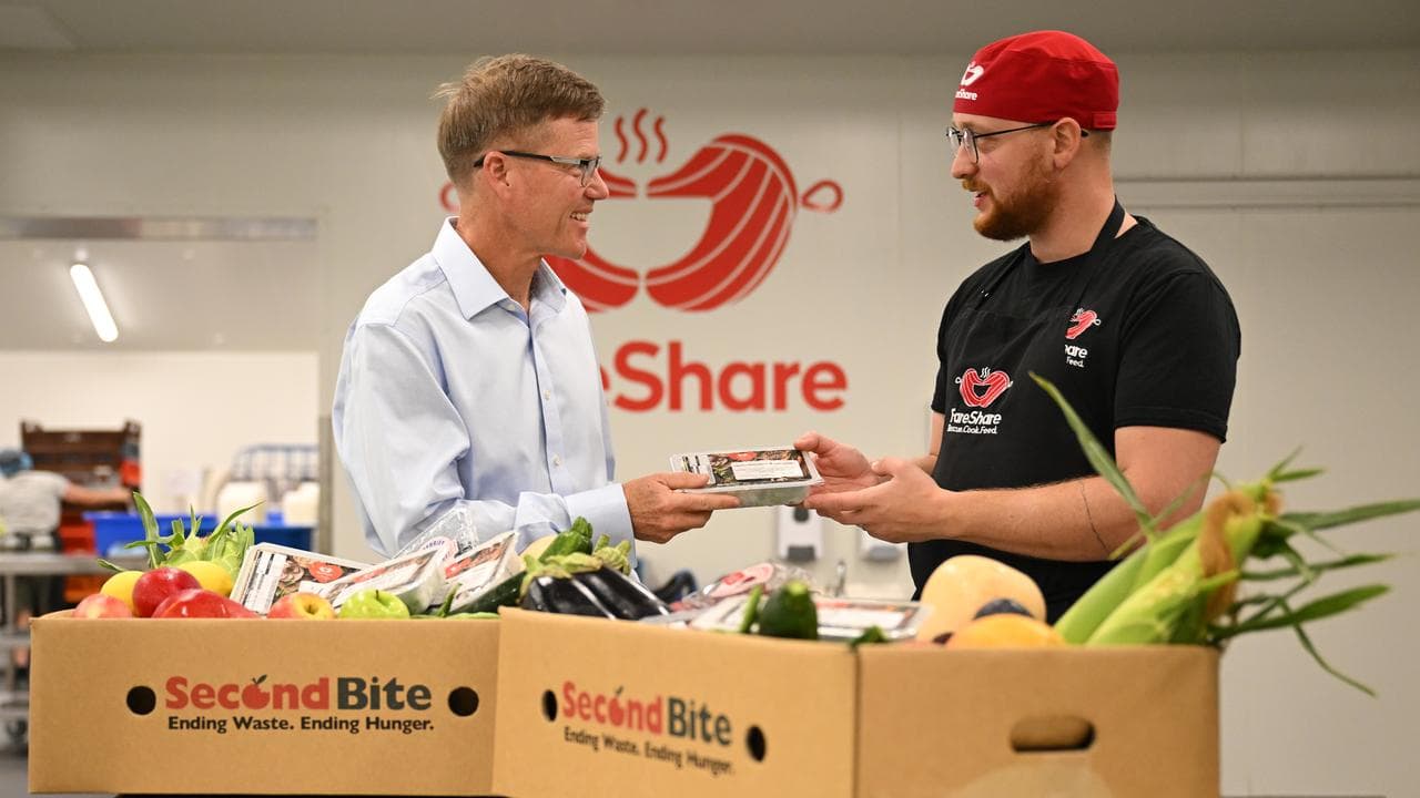 Cam Stewart and a charity worker