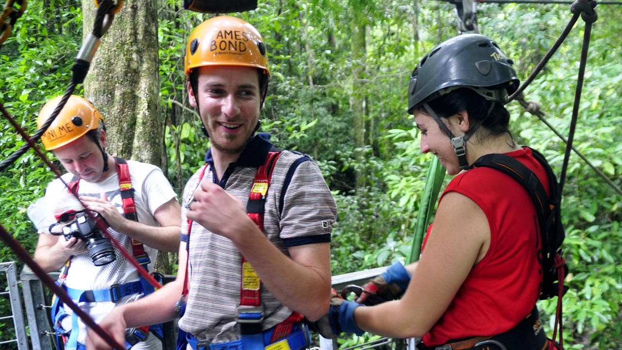 People in ziplining equipment