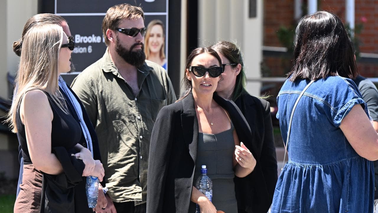 Danielle Carroll (centre), the sister of Kelly Wilkinson