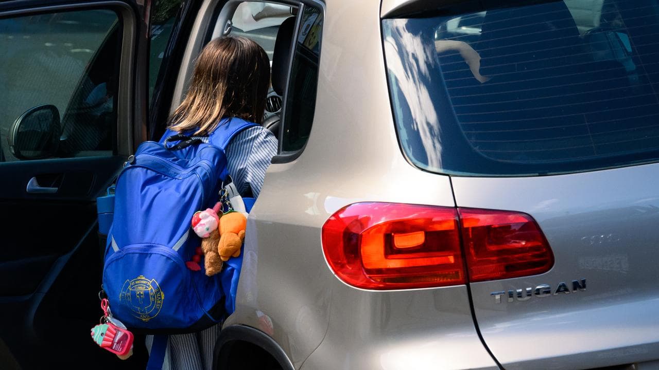 Students are seen being picked up by their parents